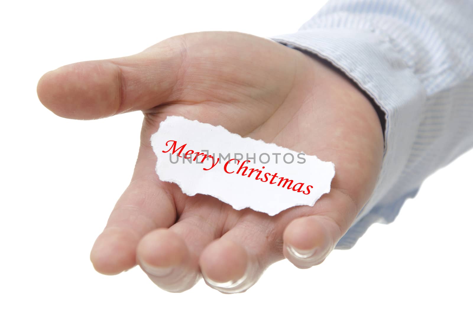 Business man holding merry christmas note on hand 