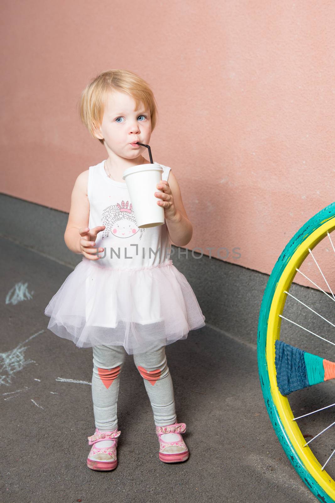 Healthy kid, milk - Portrait of lovely girl drinking fresh milk outdoors