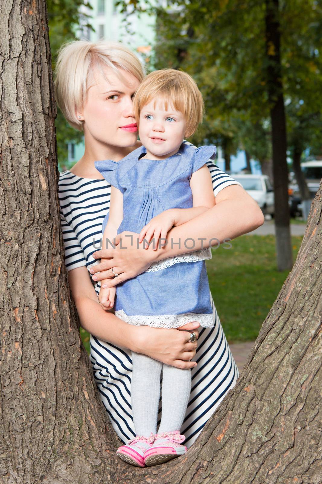 Young mother and her toddler girl have fun