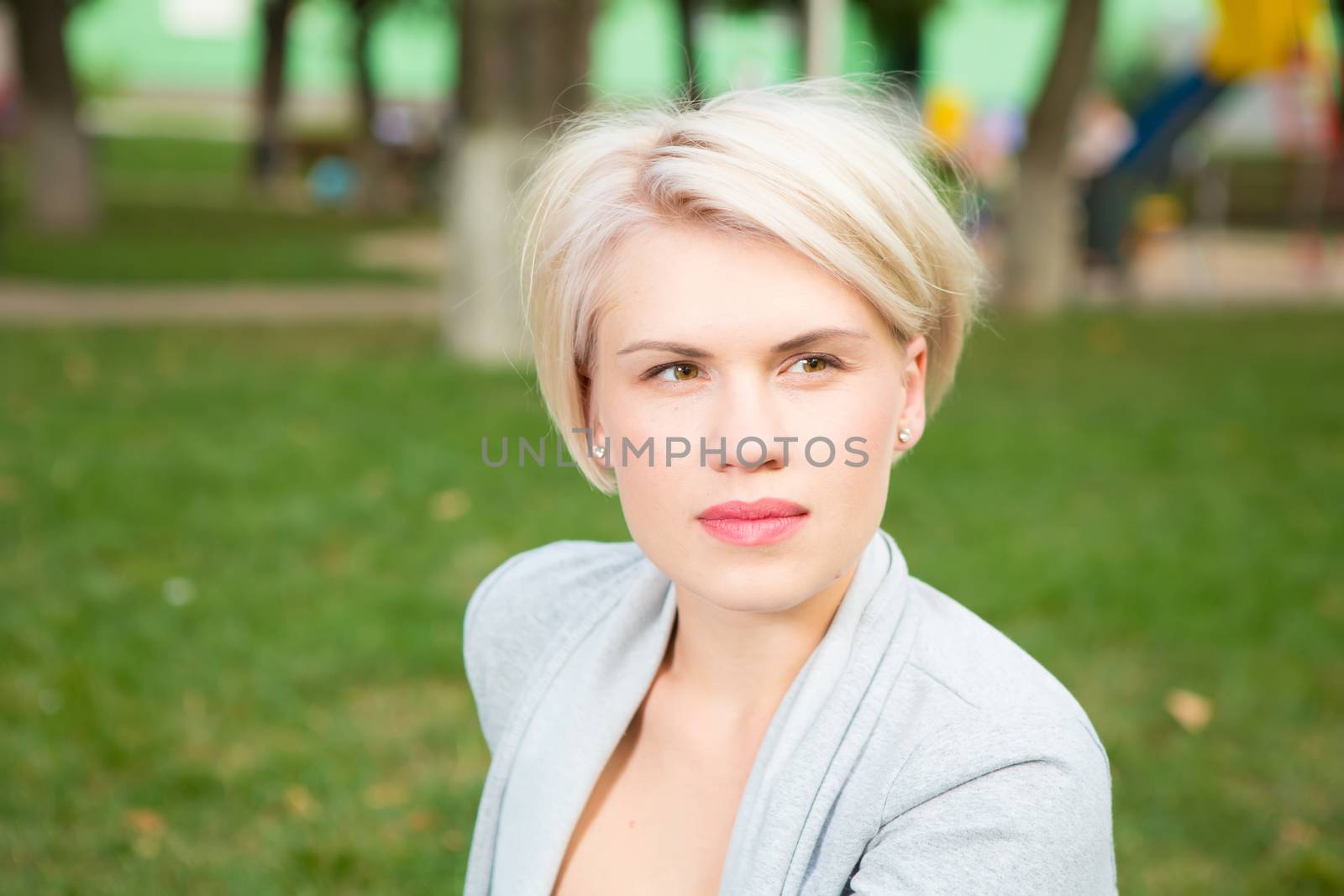 portrait of a beautiful blonde outdoors in the park