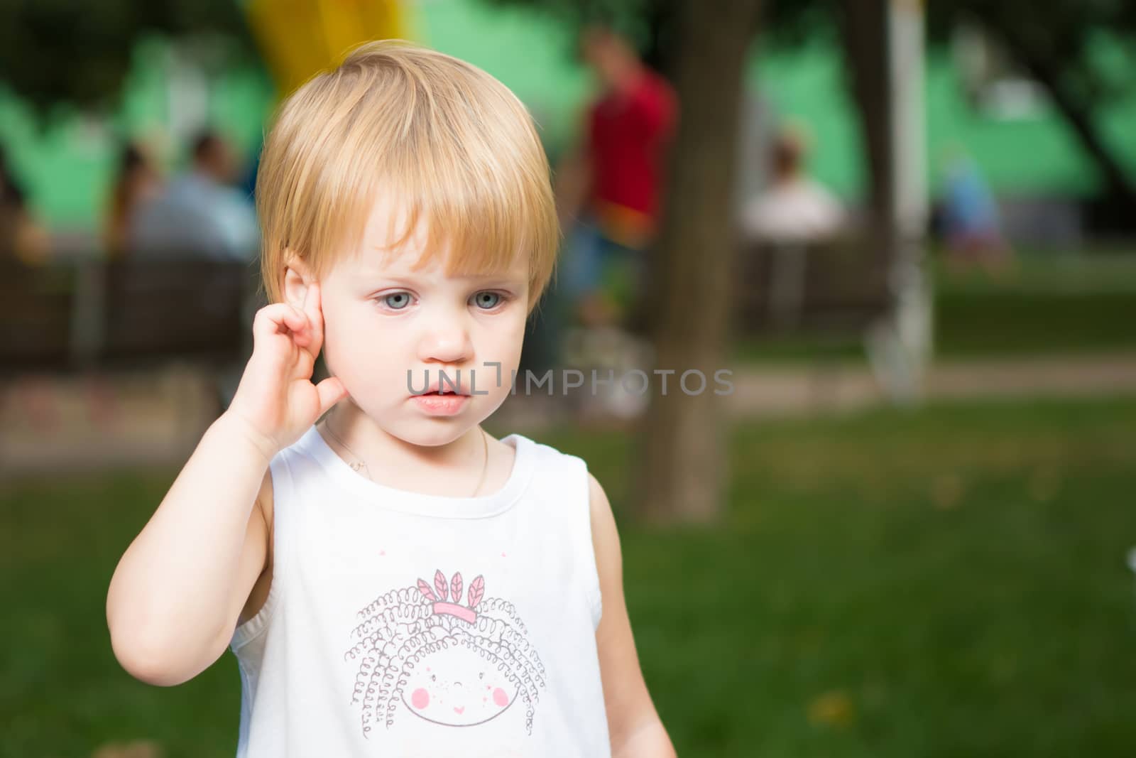 Outdoor portrait  of cute little girl in summer day