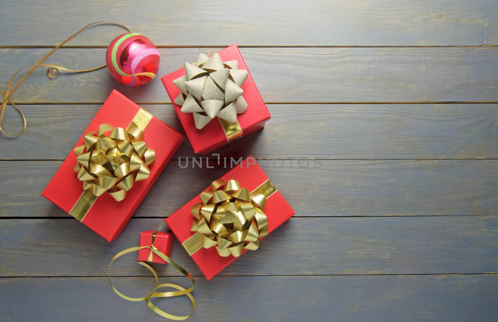 Christmas gifts and decorations over a wooden background