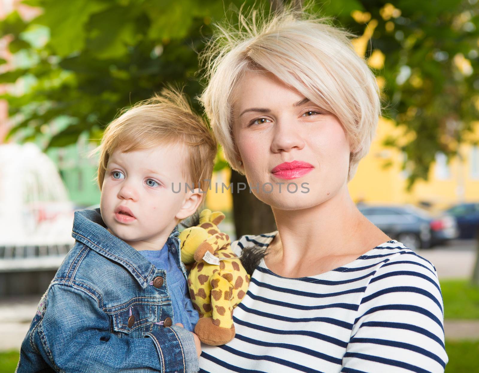 Young mother and her toddler girl have fun