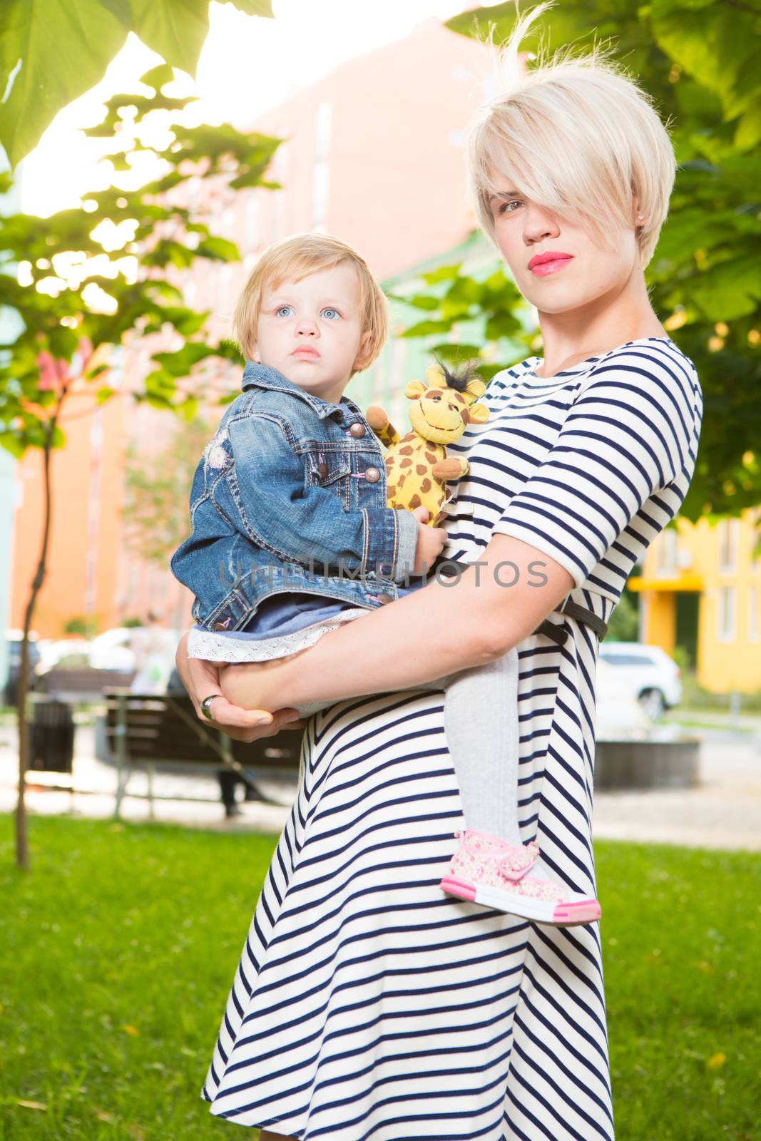 Young mother and her toddler girl have fun