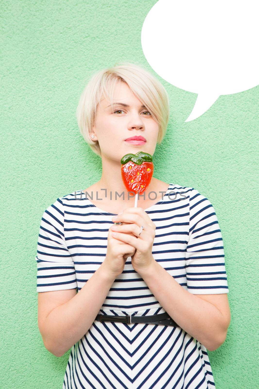 Young sexy woman sucking lollipop.  by sarymsakov