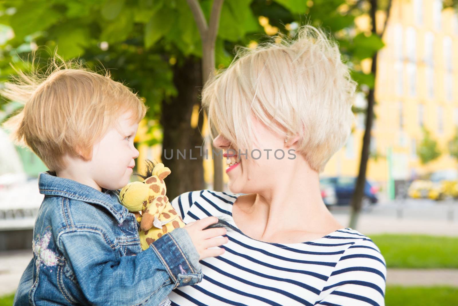 Young mother and her toddler girl have fun