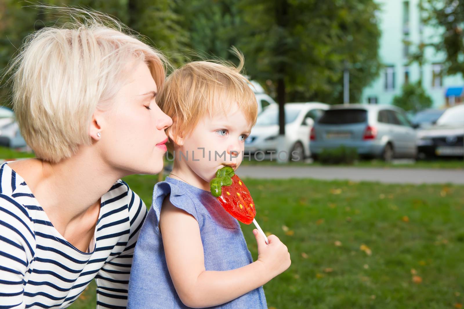 Young mother and her toddler girl have fun
