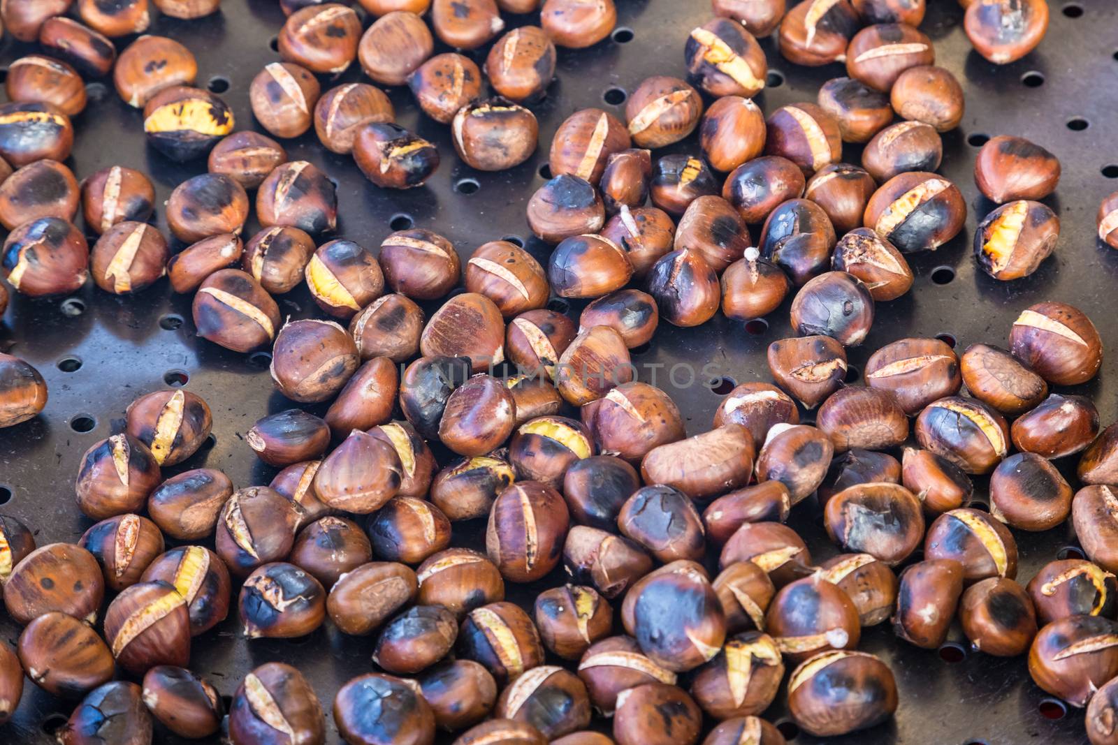 Grilled chestnuts being selled at stalls in autumn.