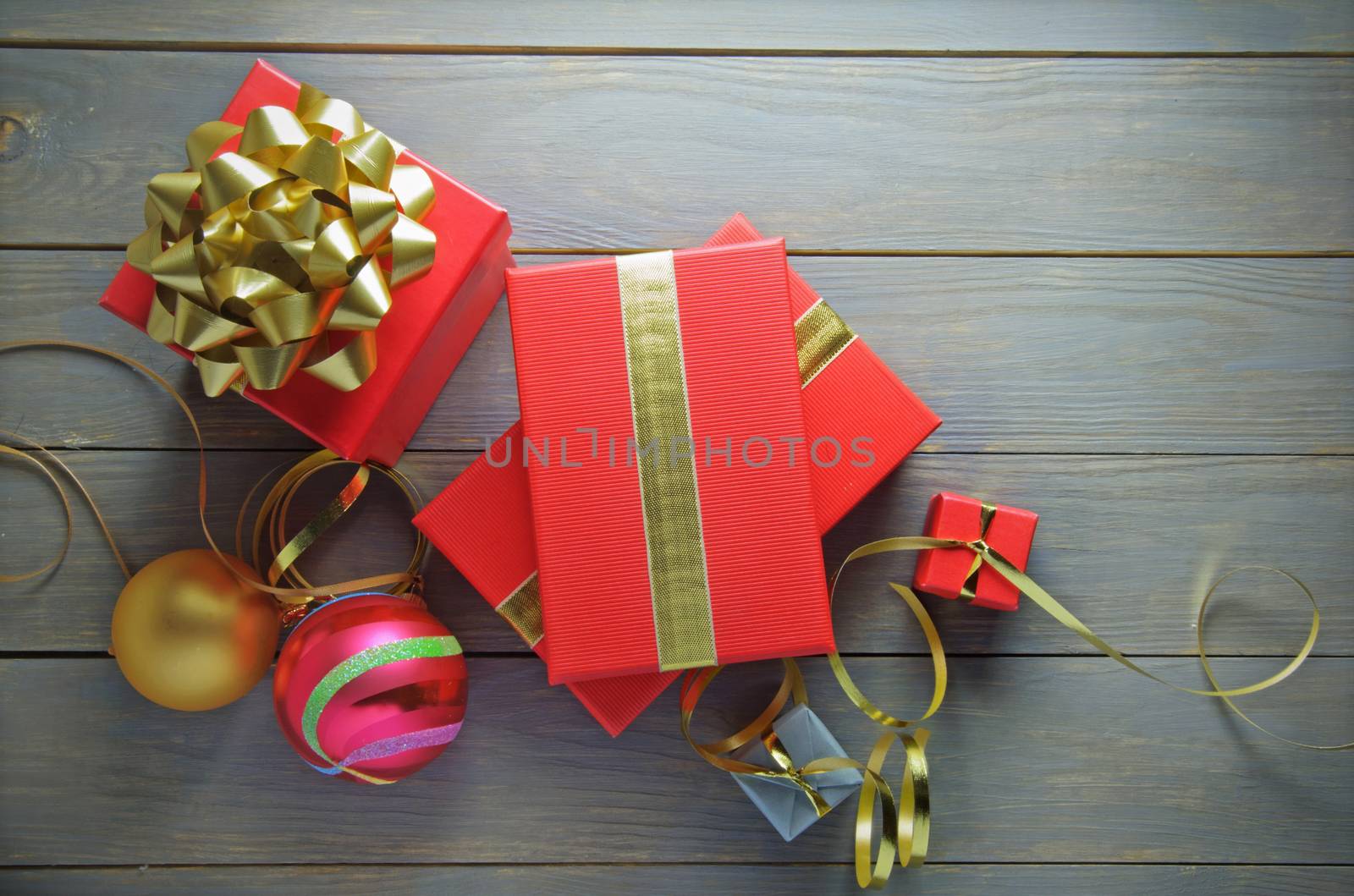 Christmas gifts and decorations over a wooden background