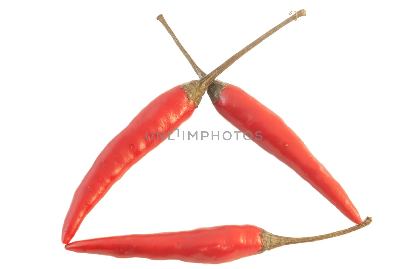 beautiful still life of tirangle of red hot chili pepper
