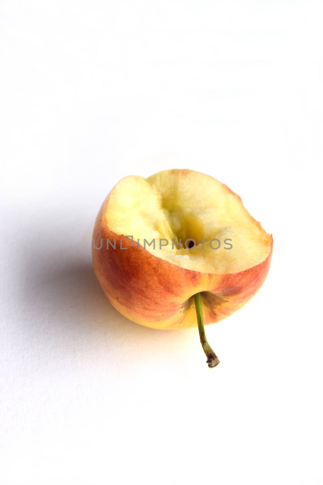 Bitten pink apple by kaidevil