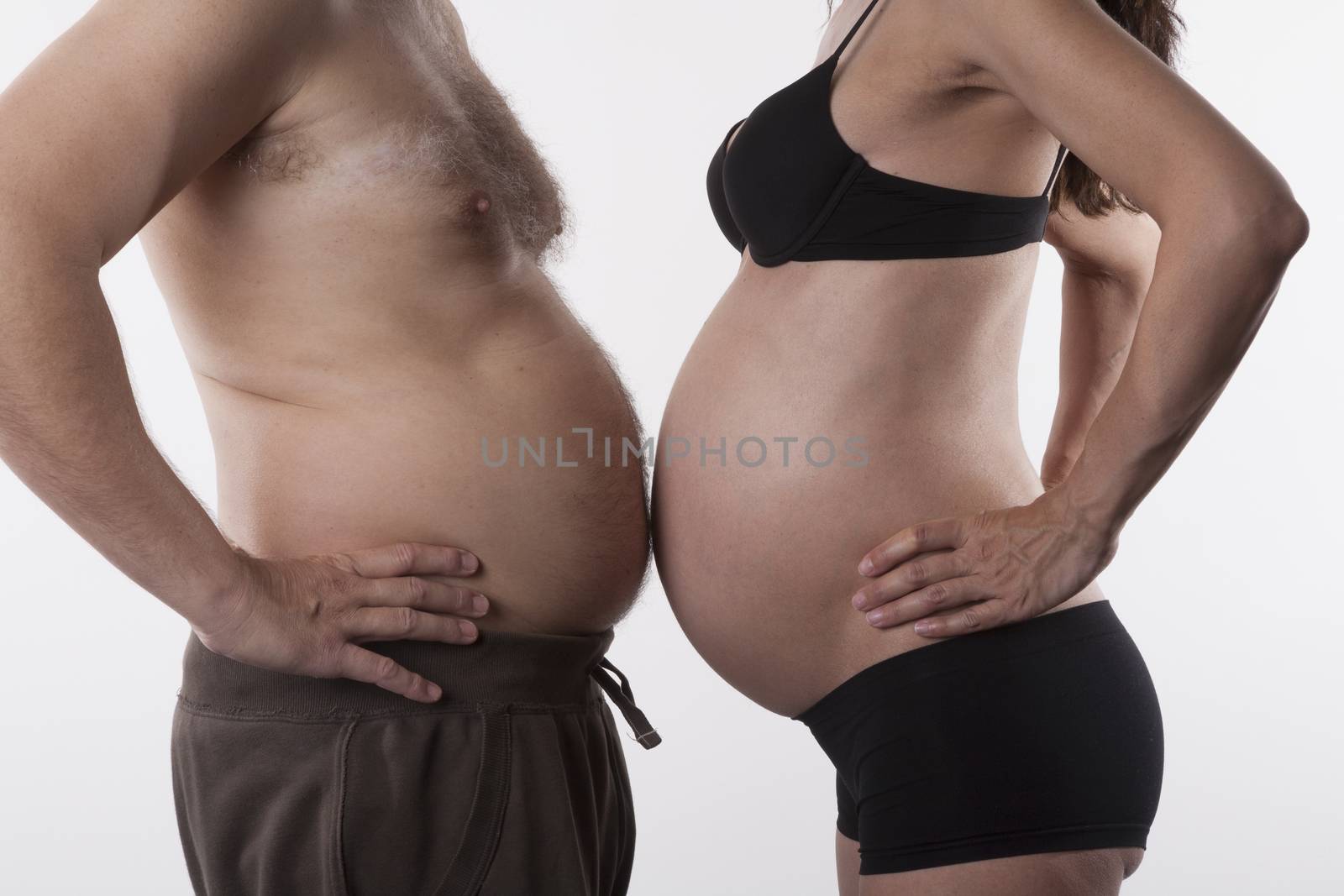 pregnant woman and fat man top nude on white background