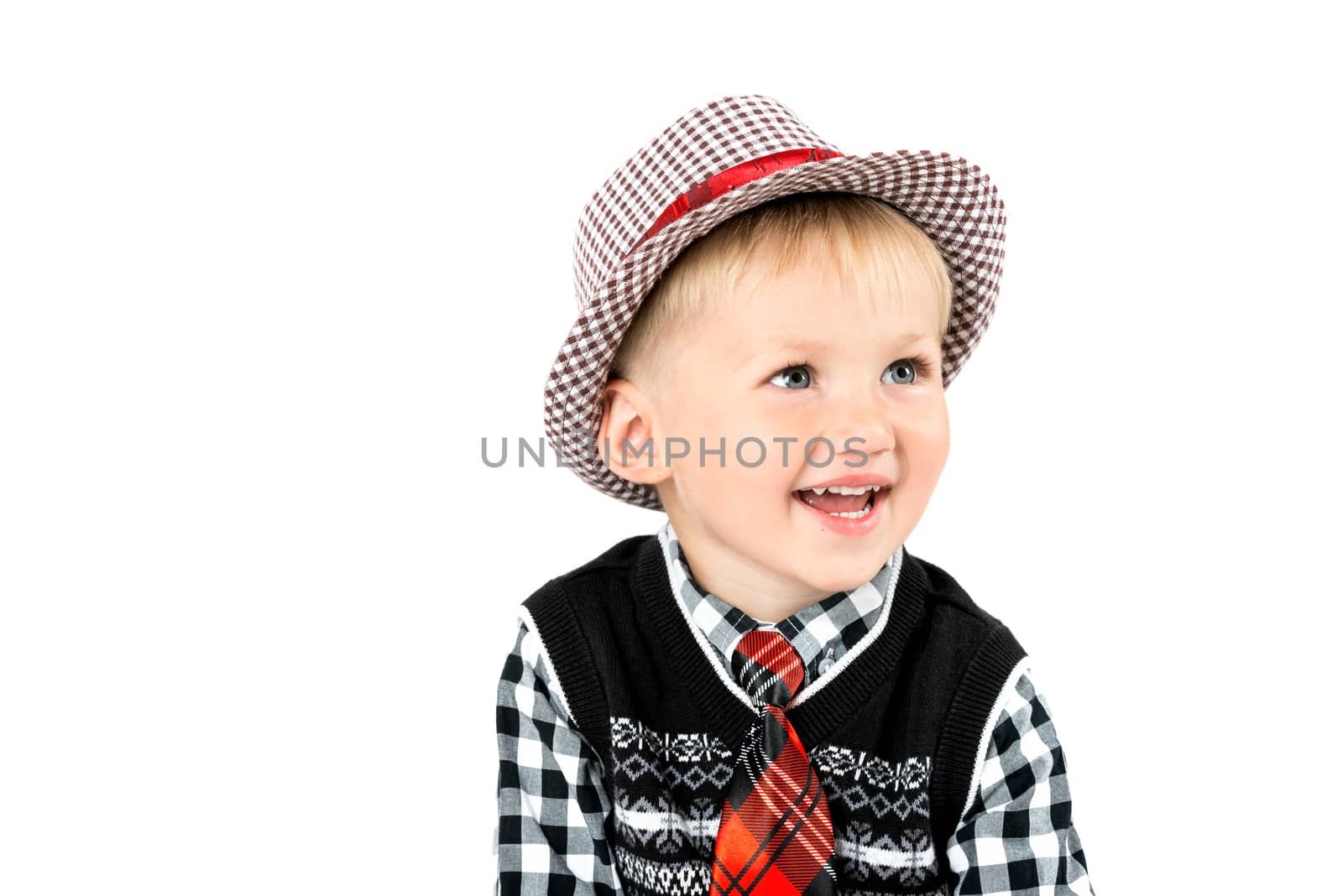 Smiling happy boy in tie shot in the studio on a white backgroun by Nanisimova