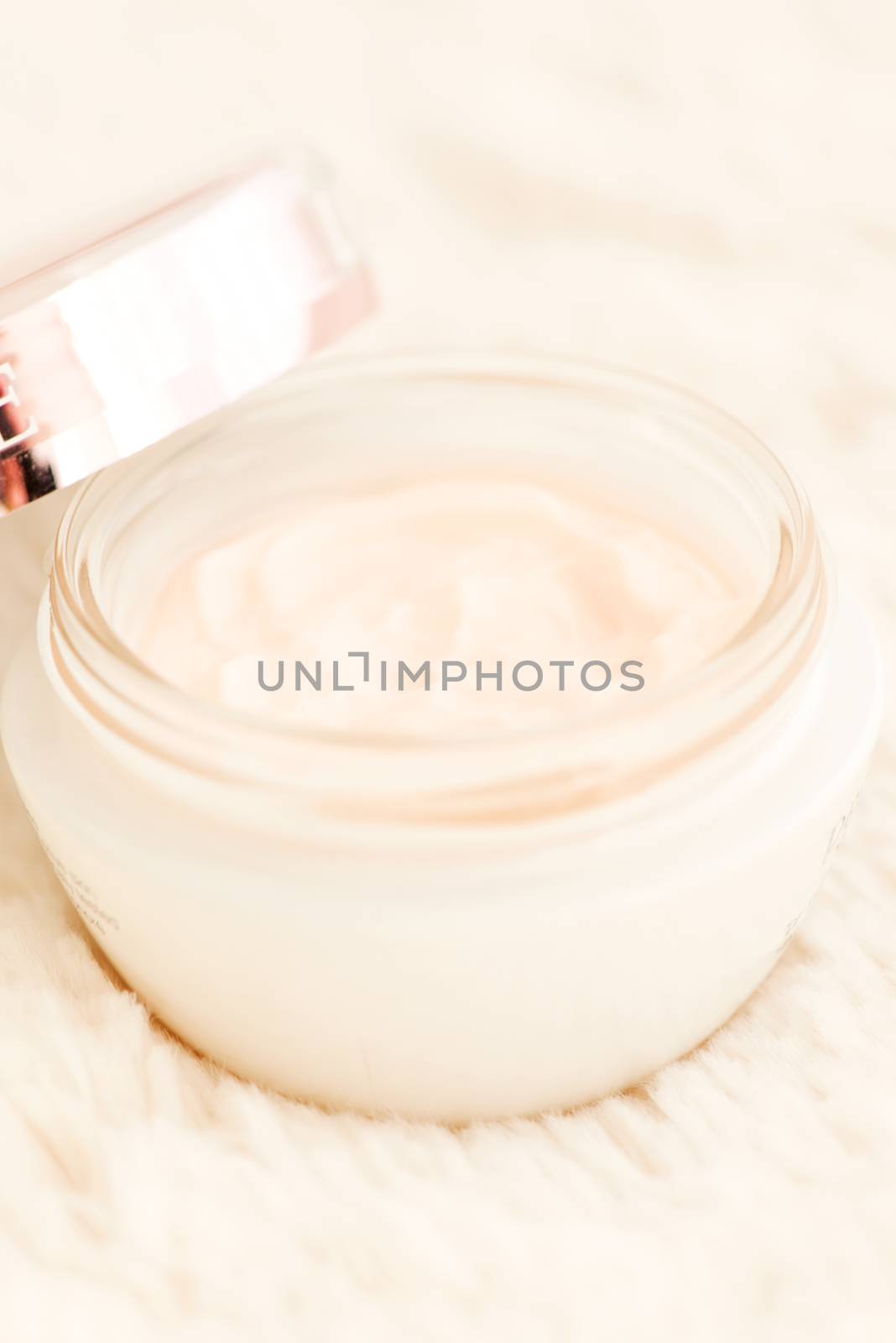 Cosmetic cream in an open jar with shallow depth of field