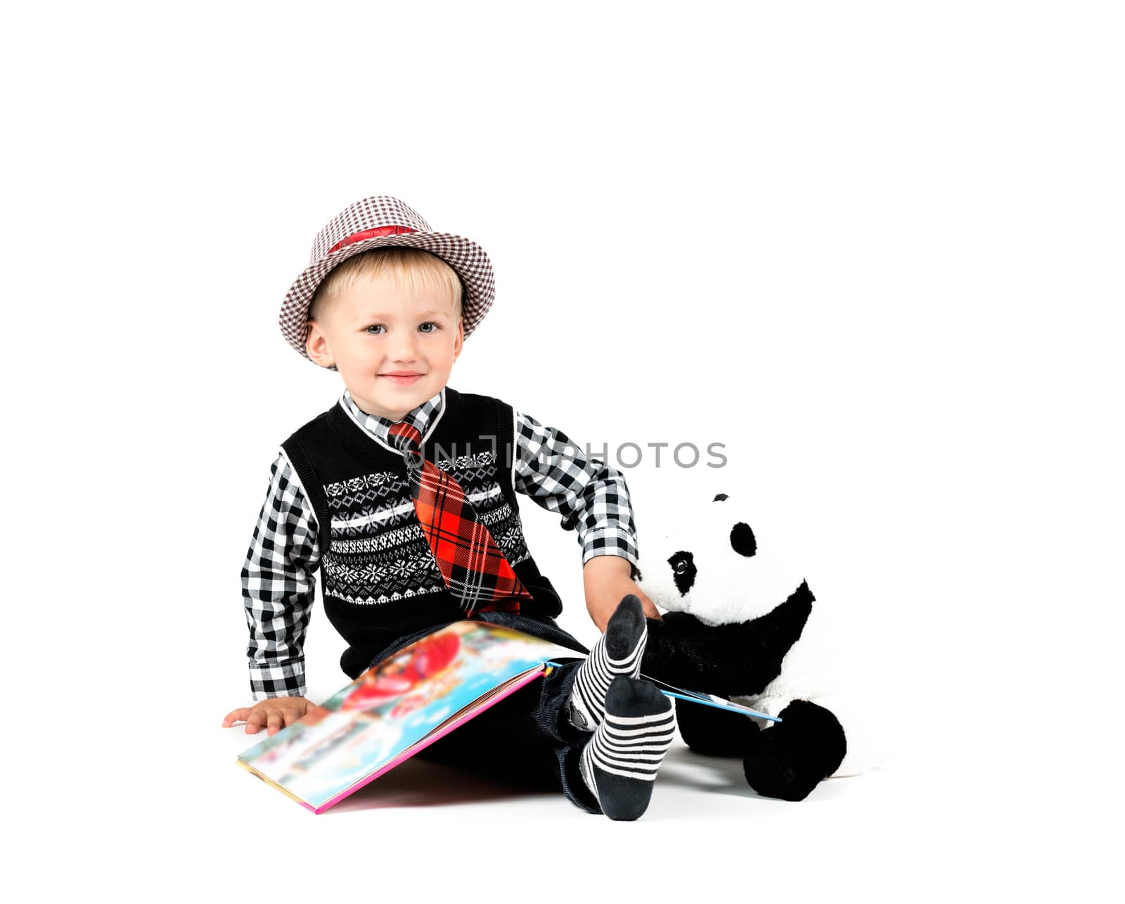 Smiling happy boy with book shot in the studio on a white backgr by Nanisimova