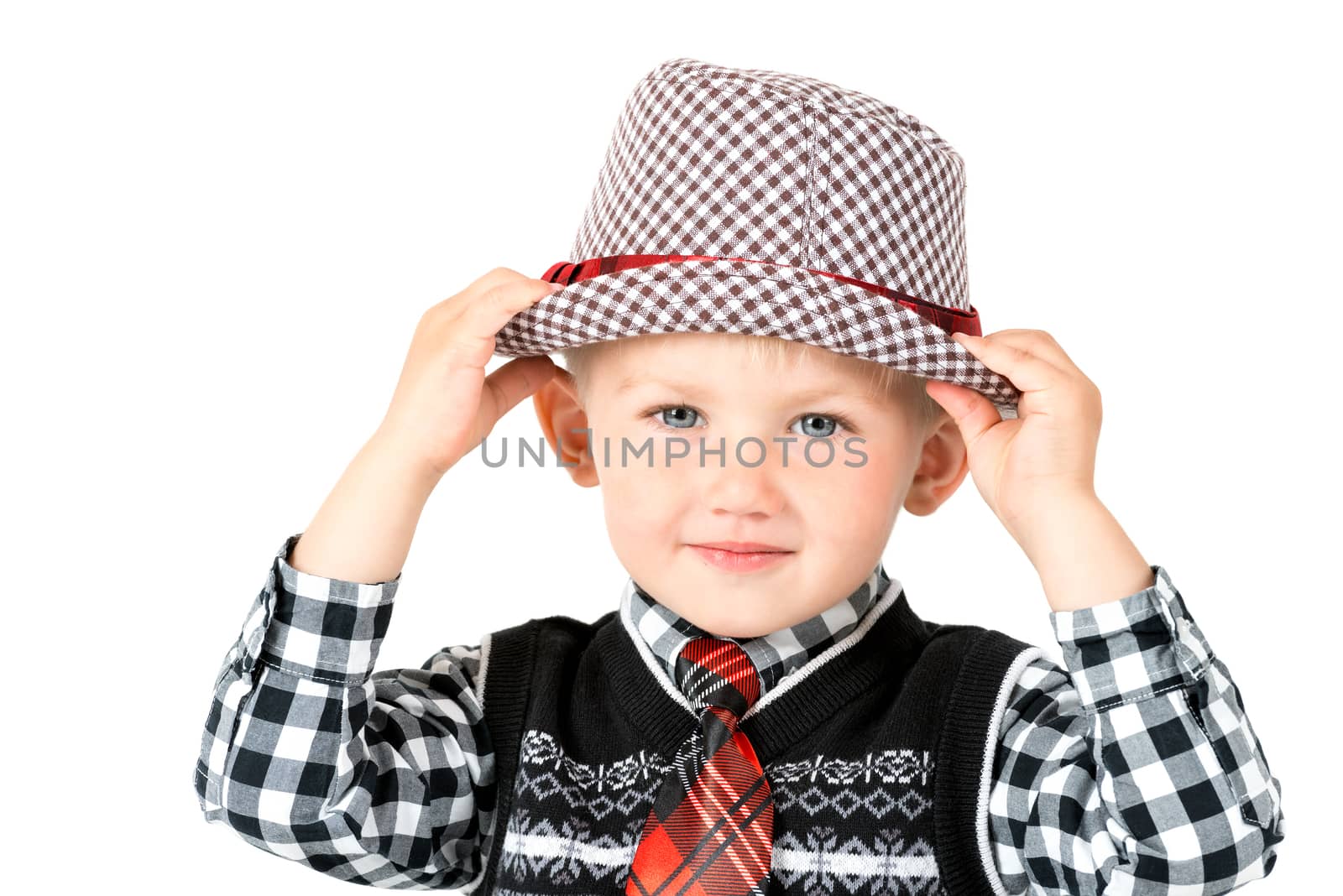 Happy boy in hat studio shot isolated on a white background by Nanisimova