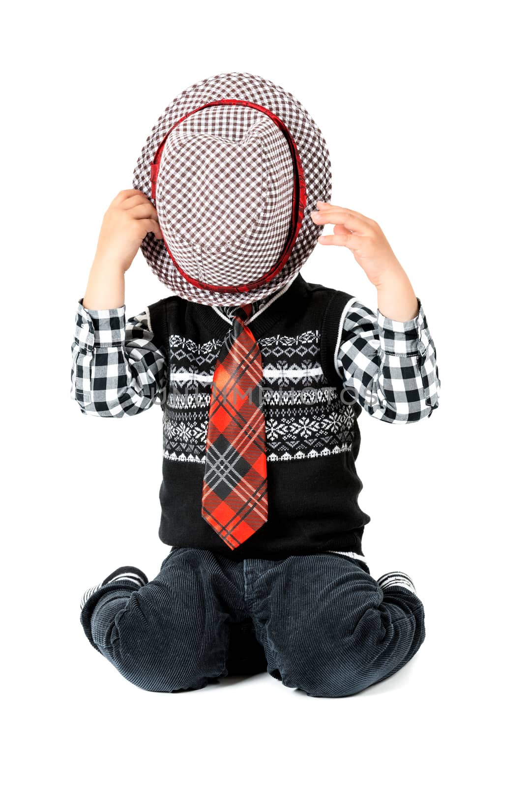 Boy with hat and tie studio shot isolated on a white background by Nanisimova