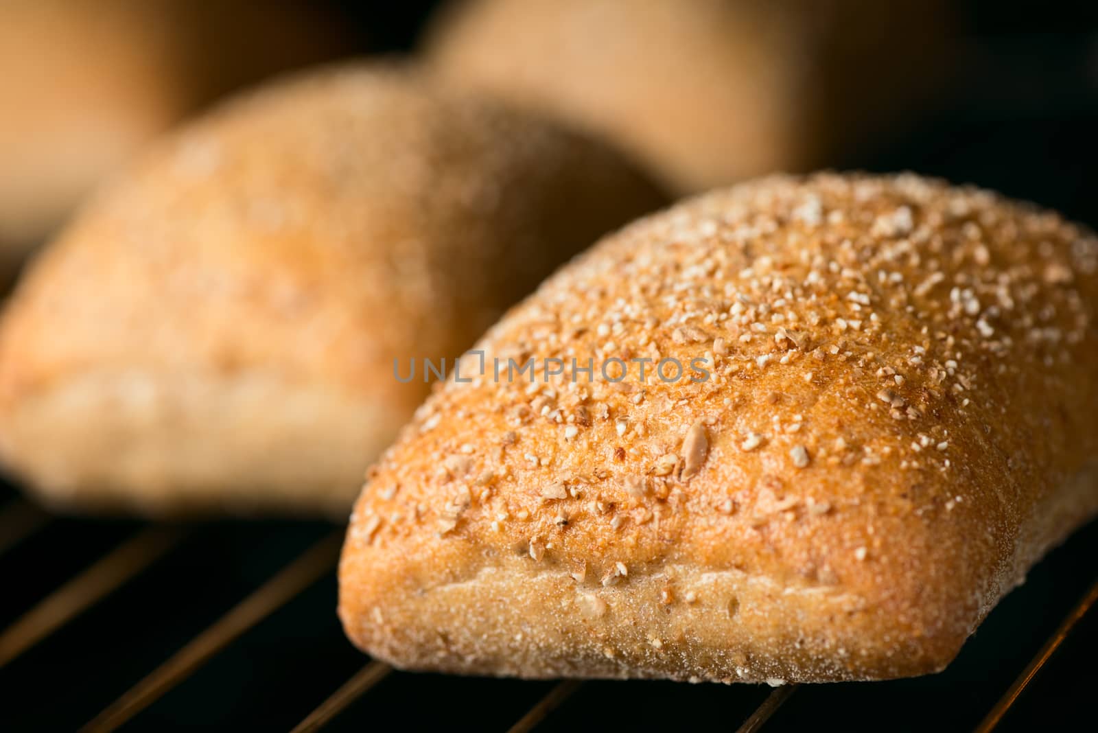 Oven baked bread selective focus by Nanisimova