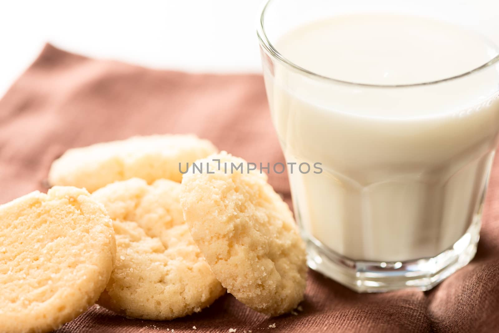 Artistic set: cookies and milk on napkin