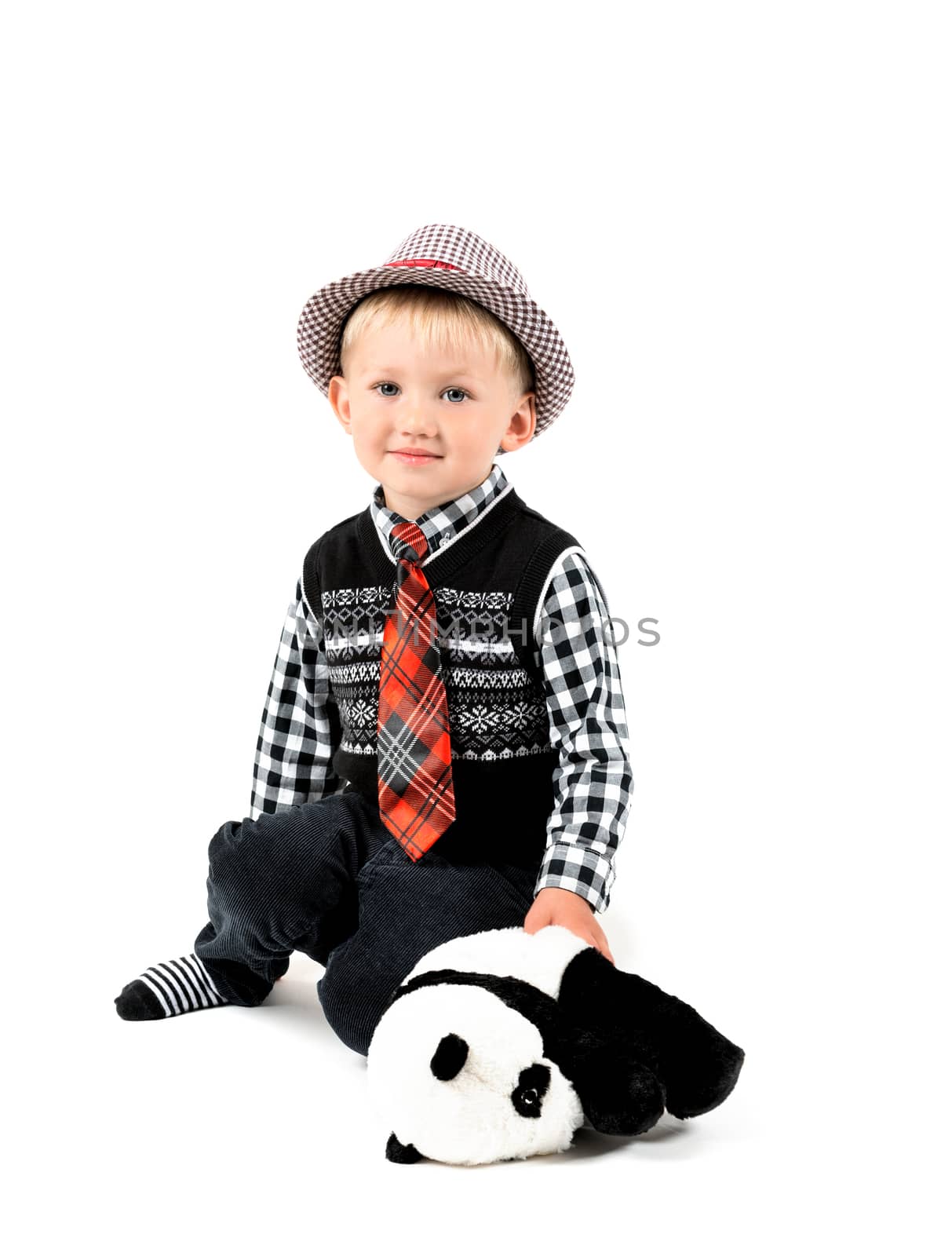 Smiling happy boy with toy shot in the studio on a white backgro by Nanisimova