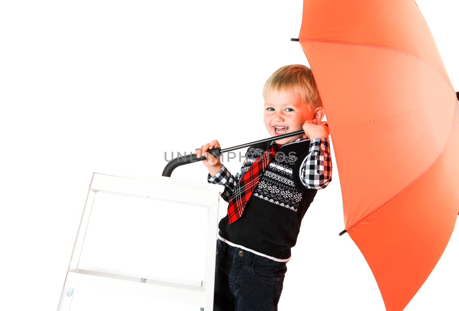 Laughing happy boy with umbrella shot in the studio on a white background