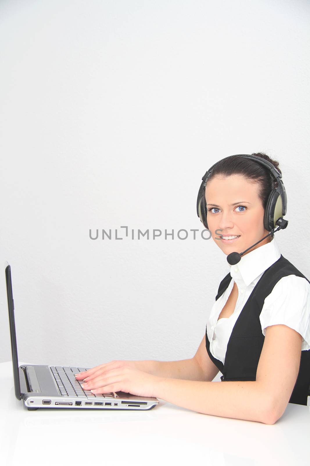 Female customer support operator with headset by mirzavis