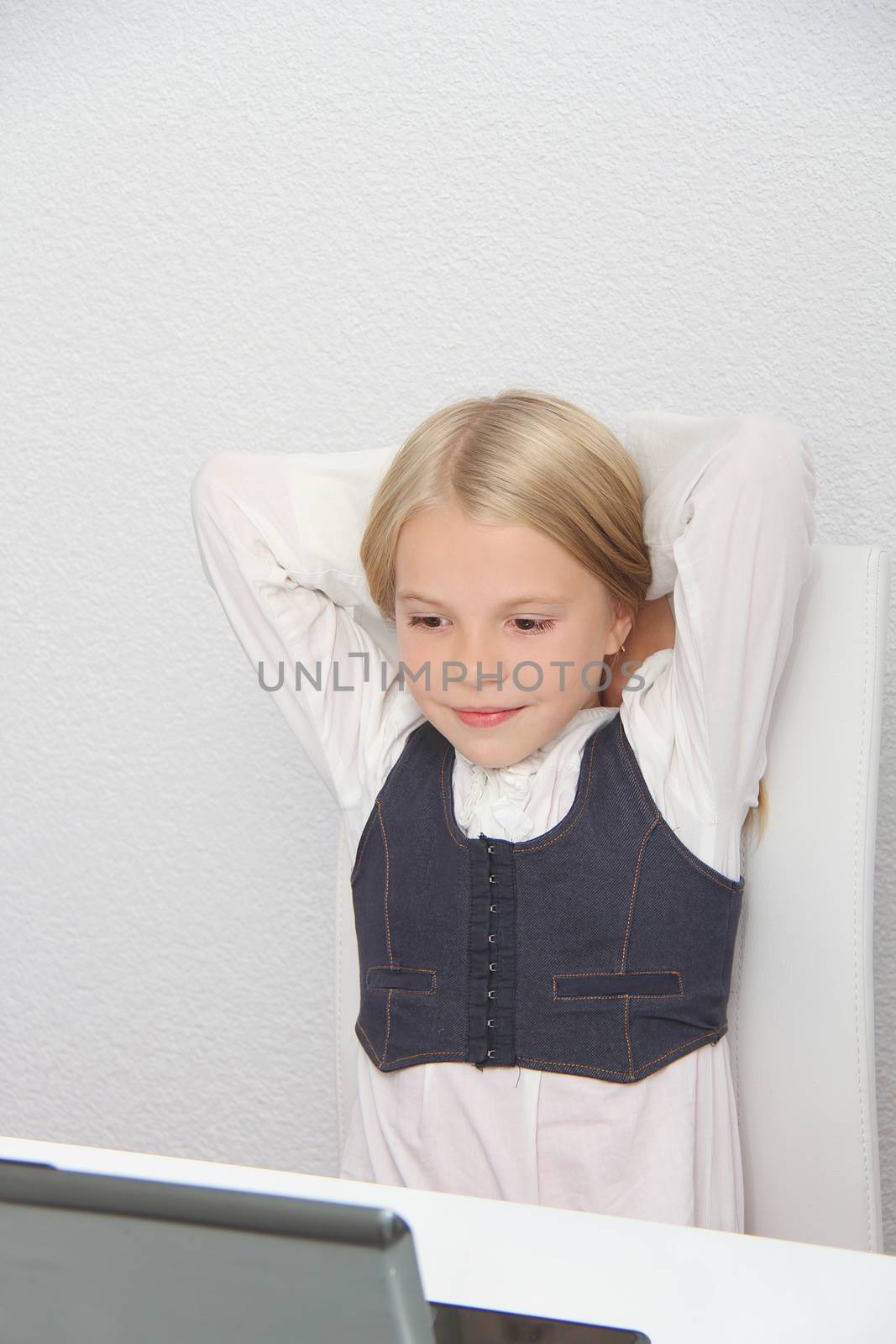 Young Girl Using Laptop At Home