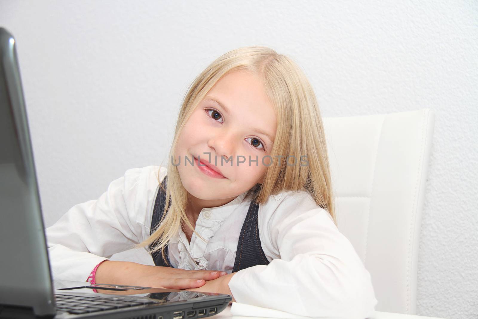 Young Girl Using Laptop At Home by mirzavis