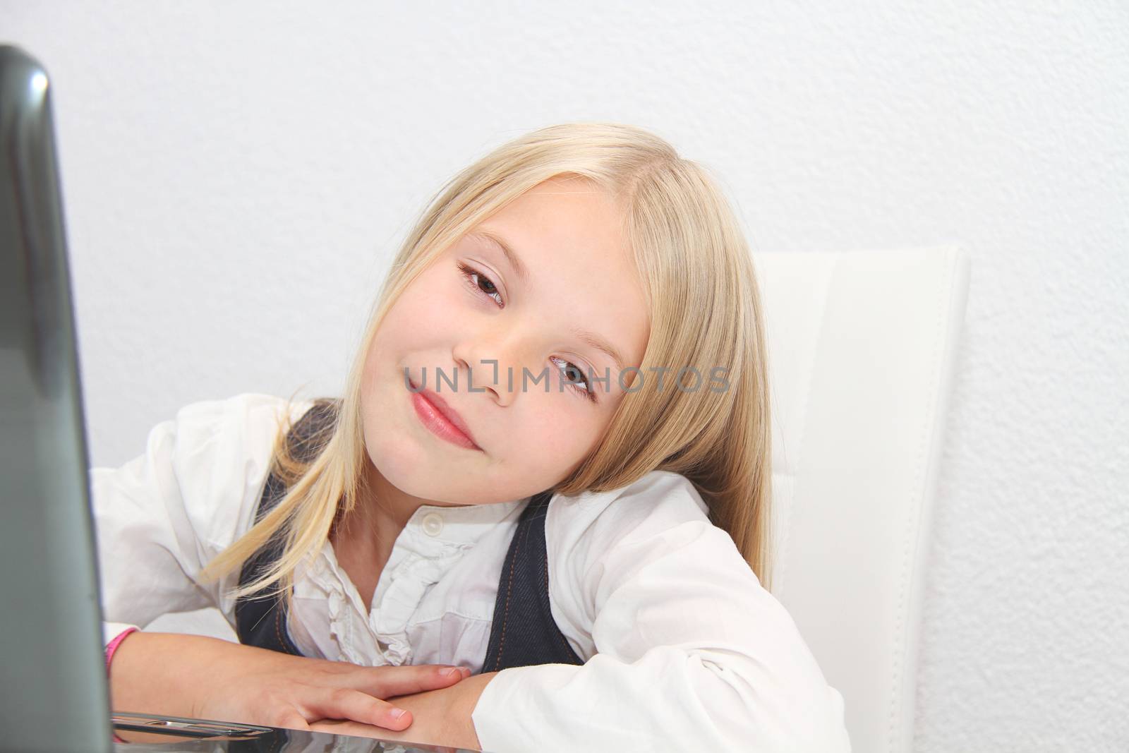 Young Girl Using Laptop At Home