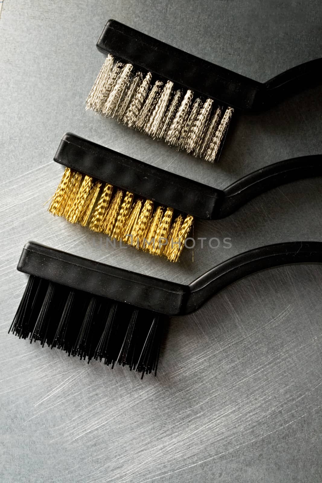 Metal brushes on steel background