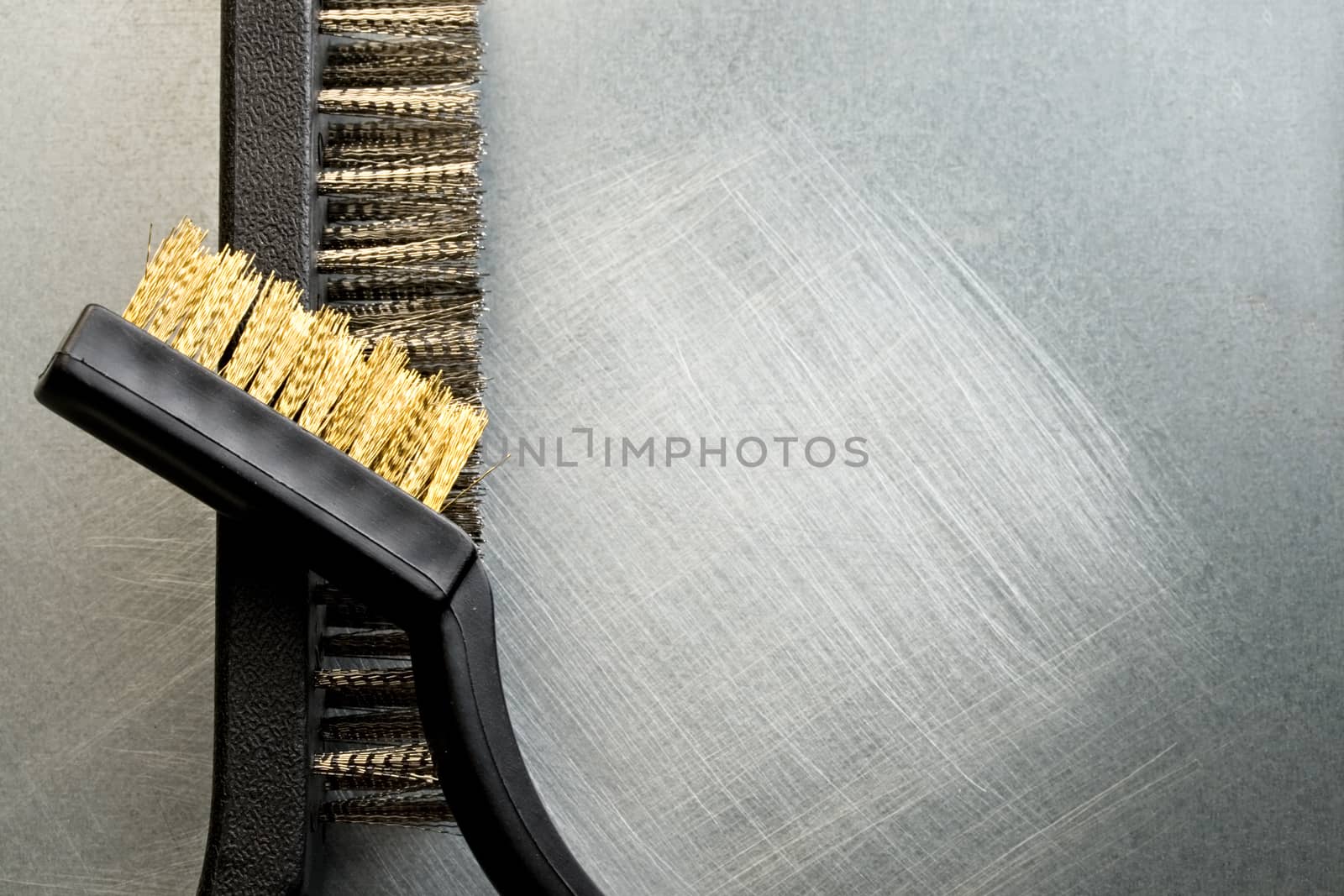 Metal brushes on steel background