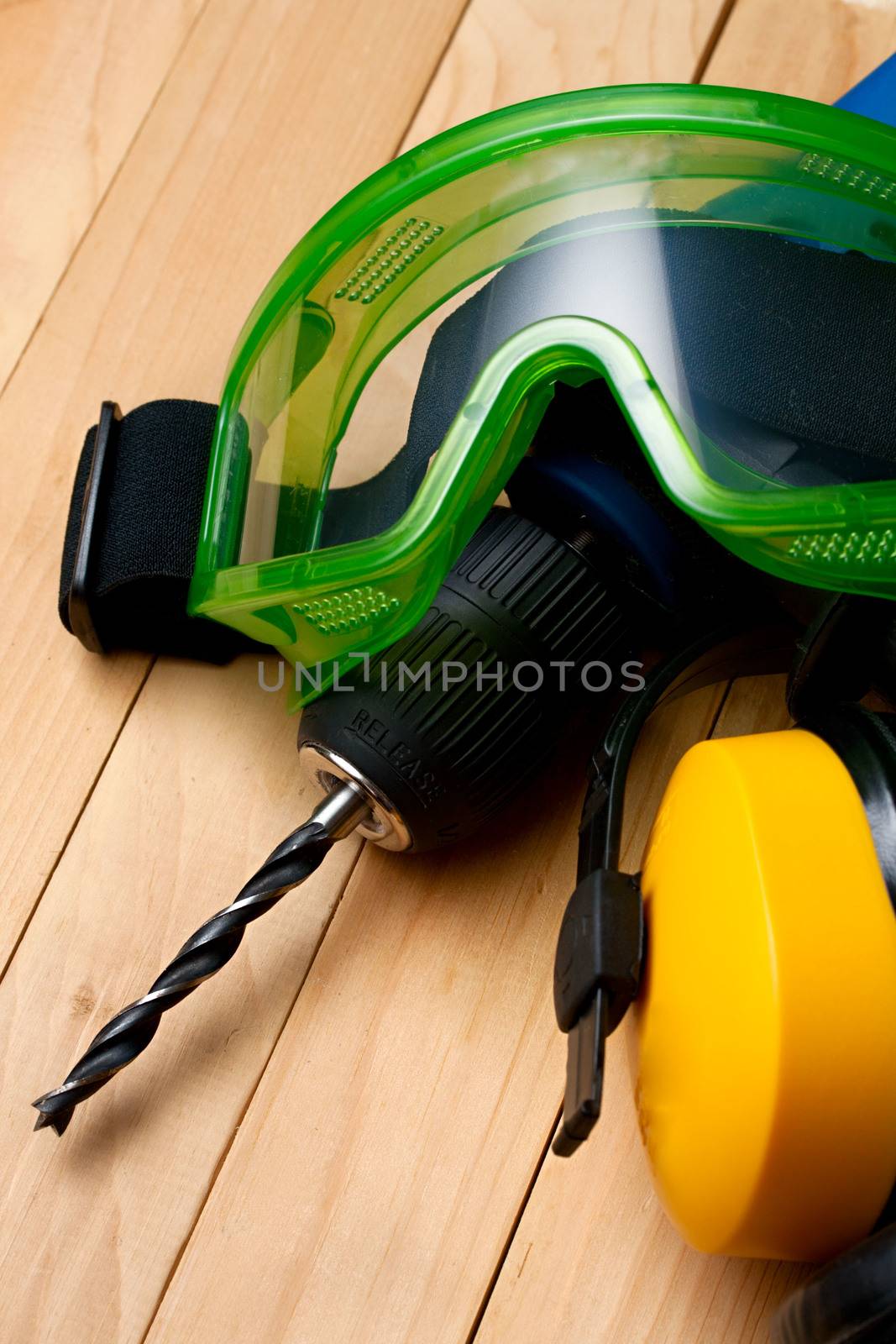 Handdrill, earphones and goggles
