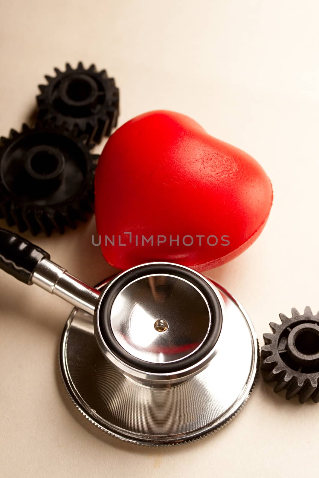 Mechanical ratchets, stethoscope and red heart by Garsya