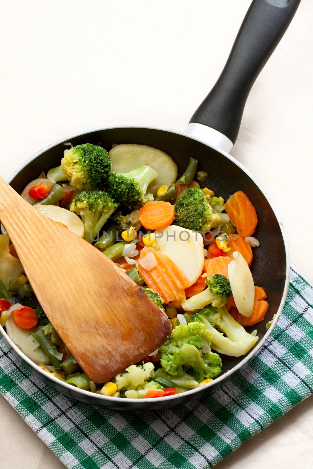 Fried vegetables in a griddle