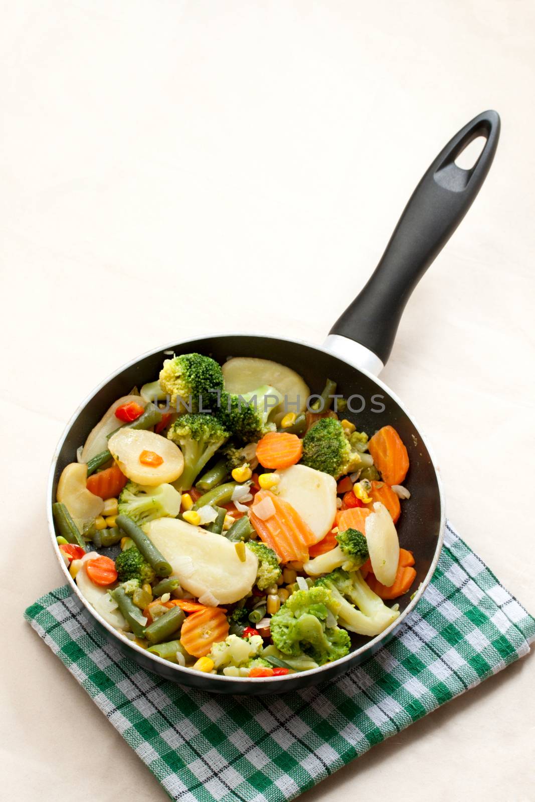 Fried vegetables in a griddle