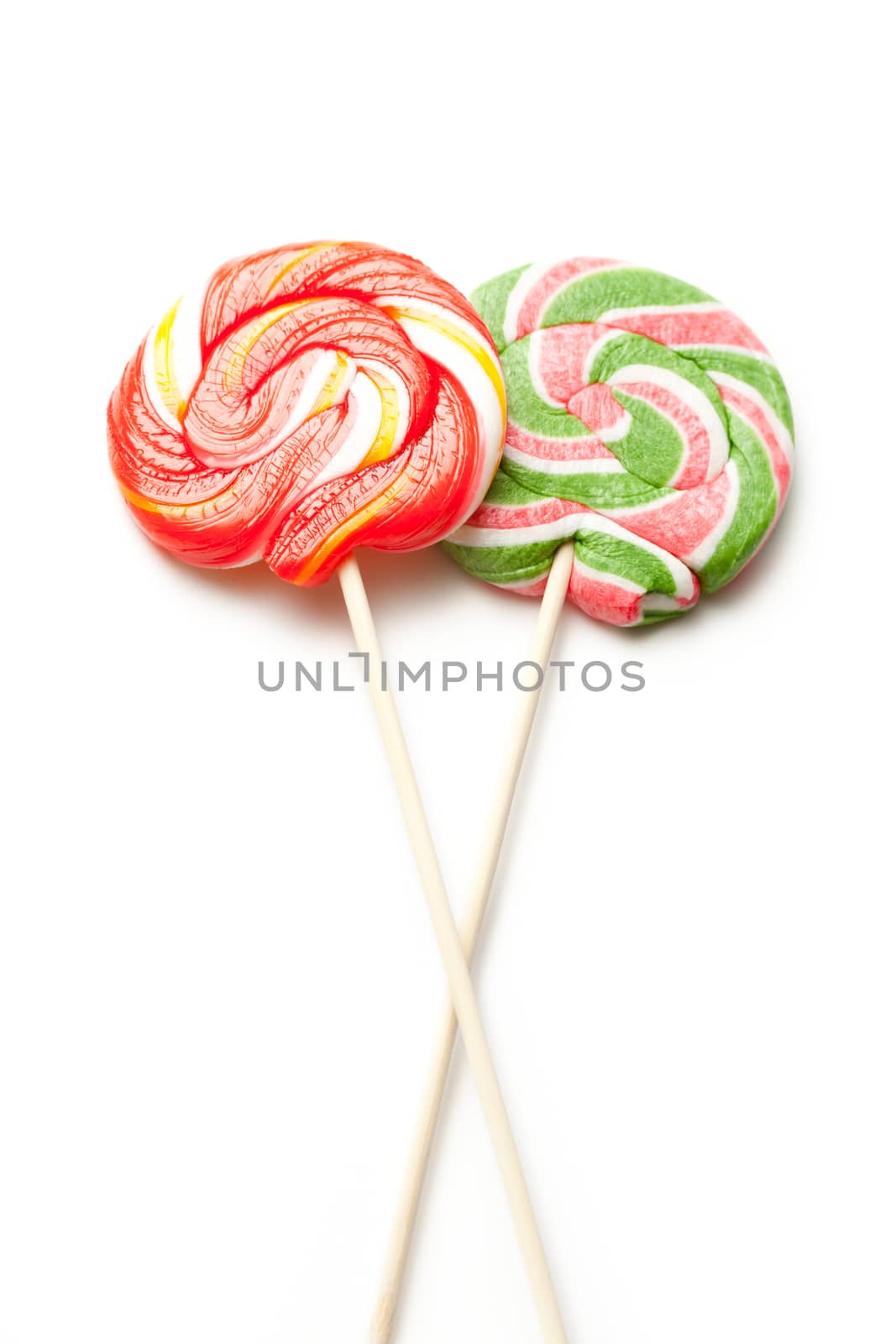 Bright lollipop candy on white background
