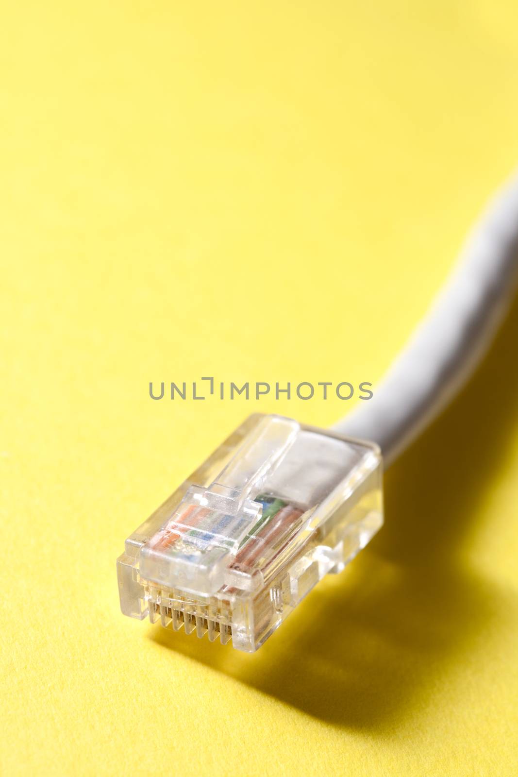 Ethernet cable for computer on yellow