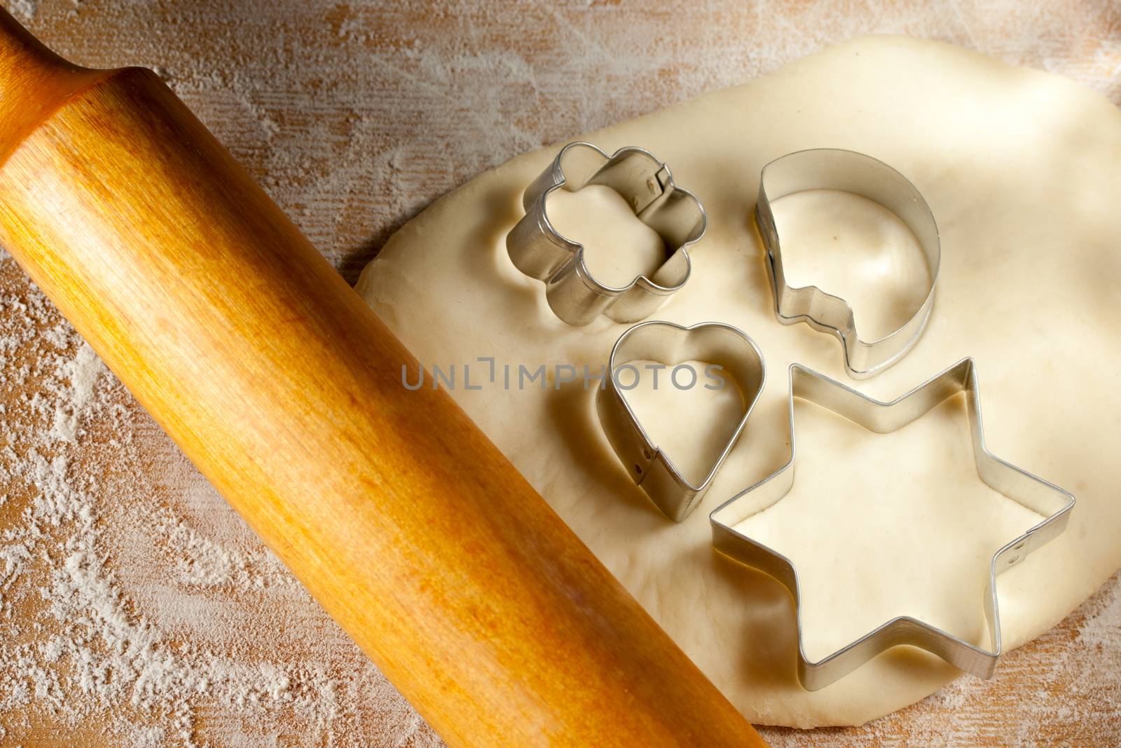 Rolling pin with dough and cookie forms