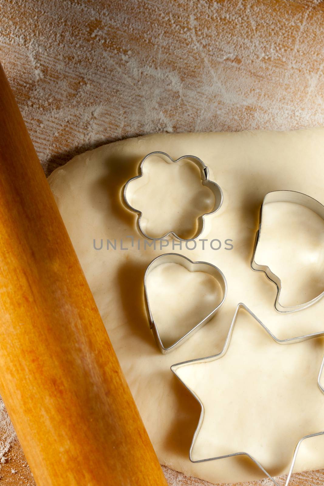 Rolling pin with dough and cookie forms