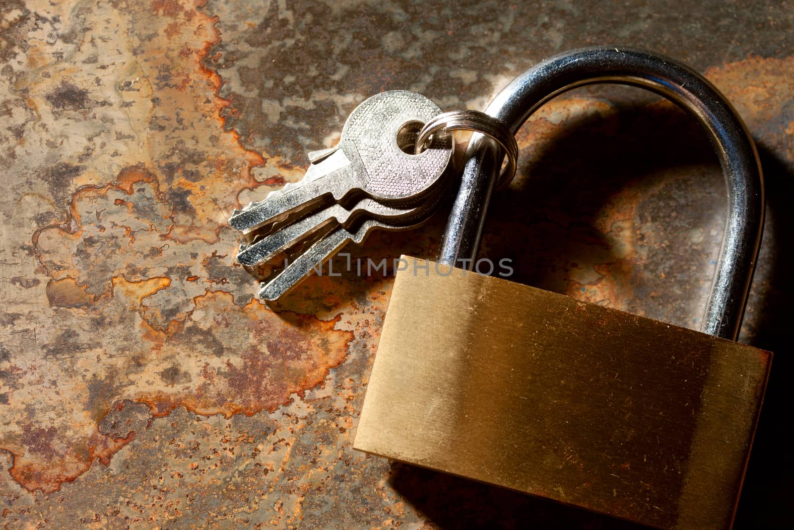 Lock with keys on the rusty background by Garsya