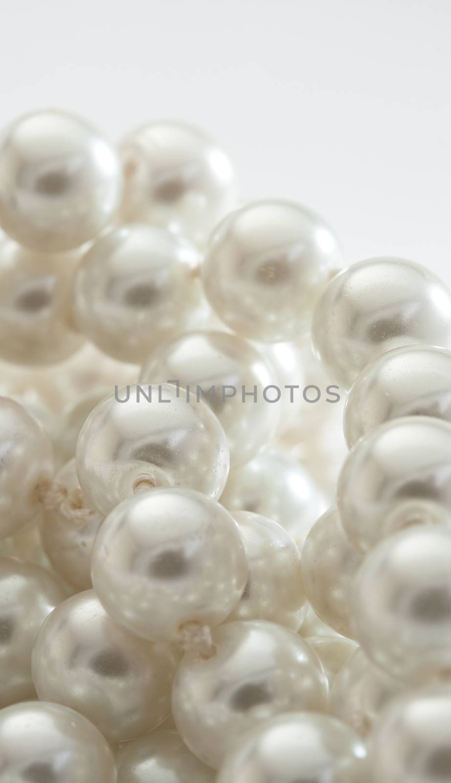 String of pearls on white by Garsya