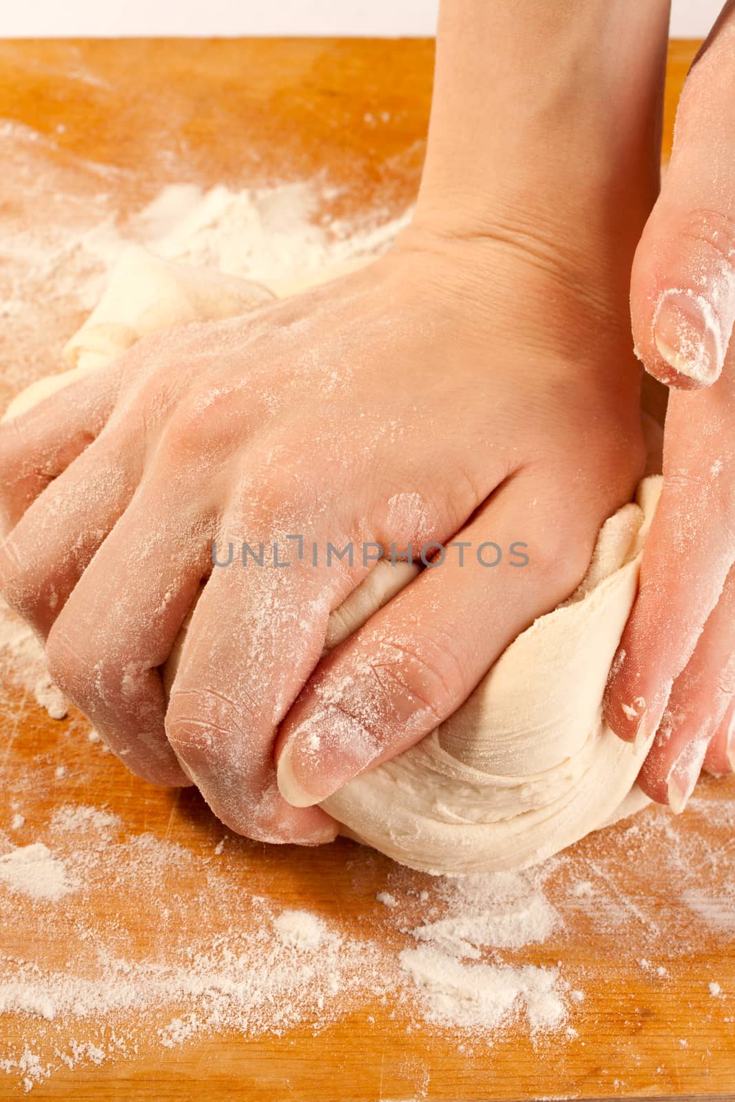 Kneading the dough with hands by Garsya