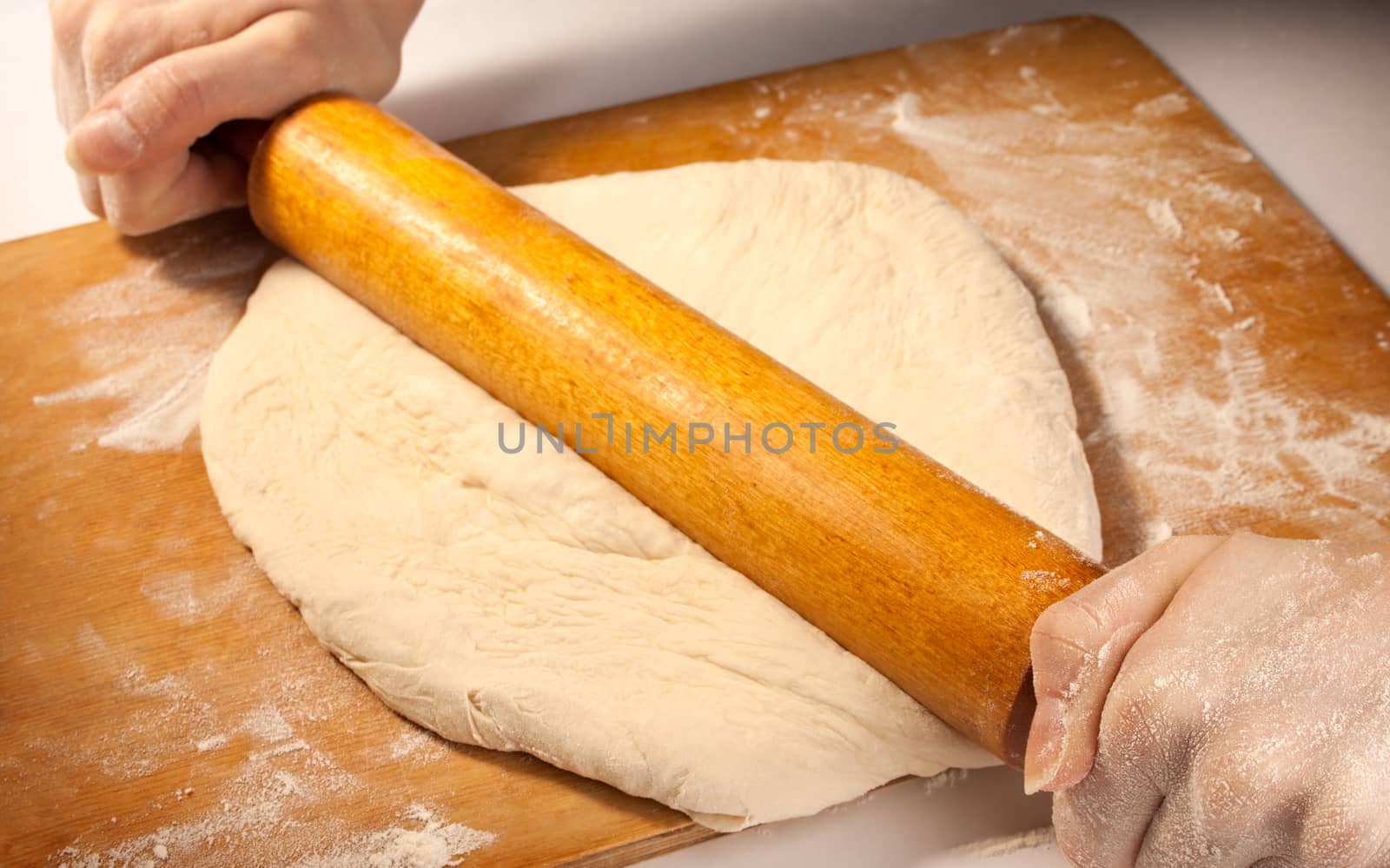 Rolling the dough with hands