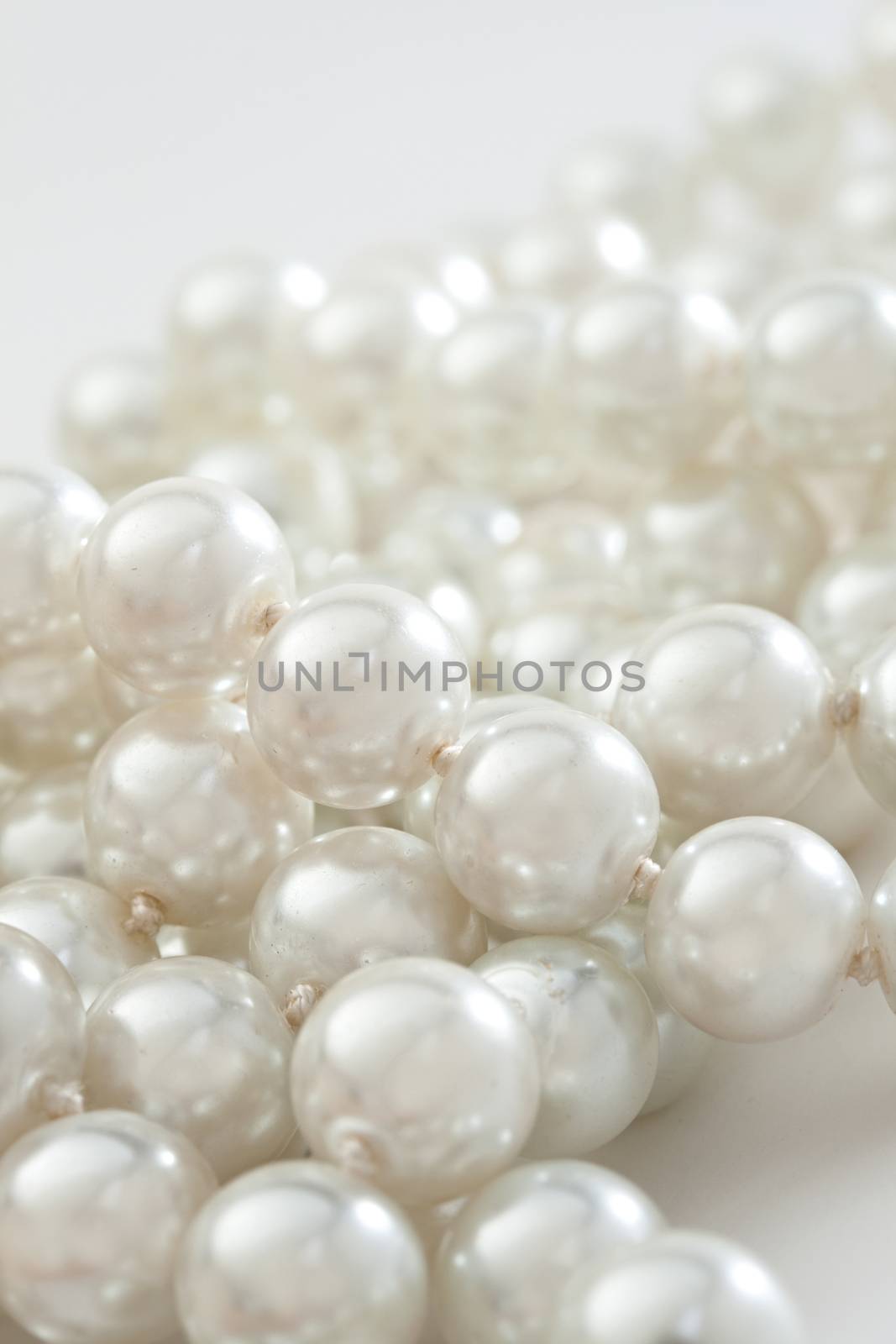 String of pearls on white