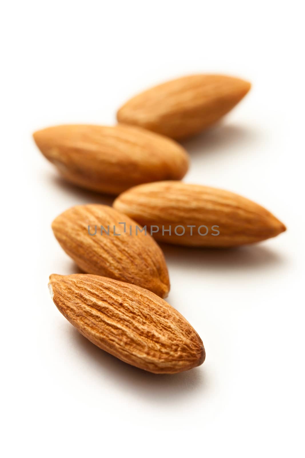 Almonds on the white background by Garsya