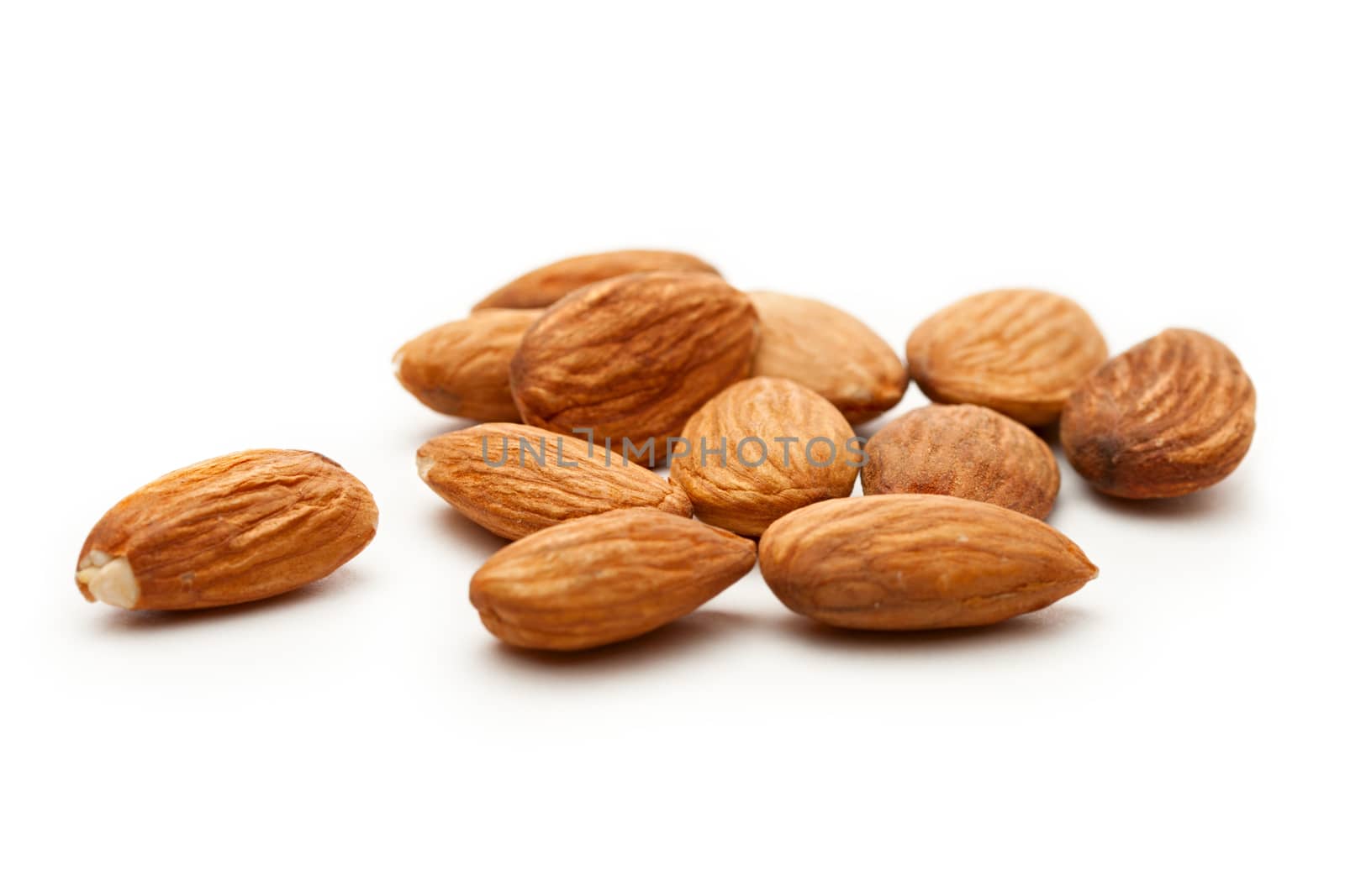 Almonds on the white background by Garsya