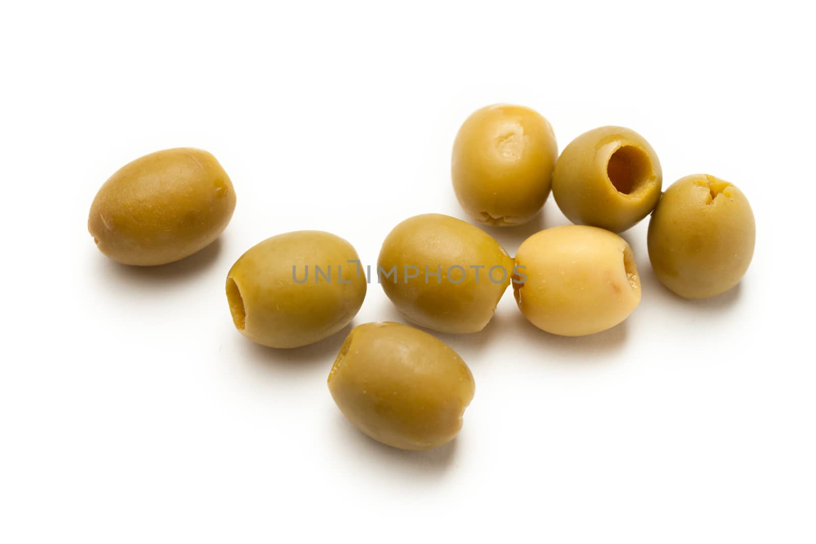 Heap of green seedless olives