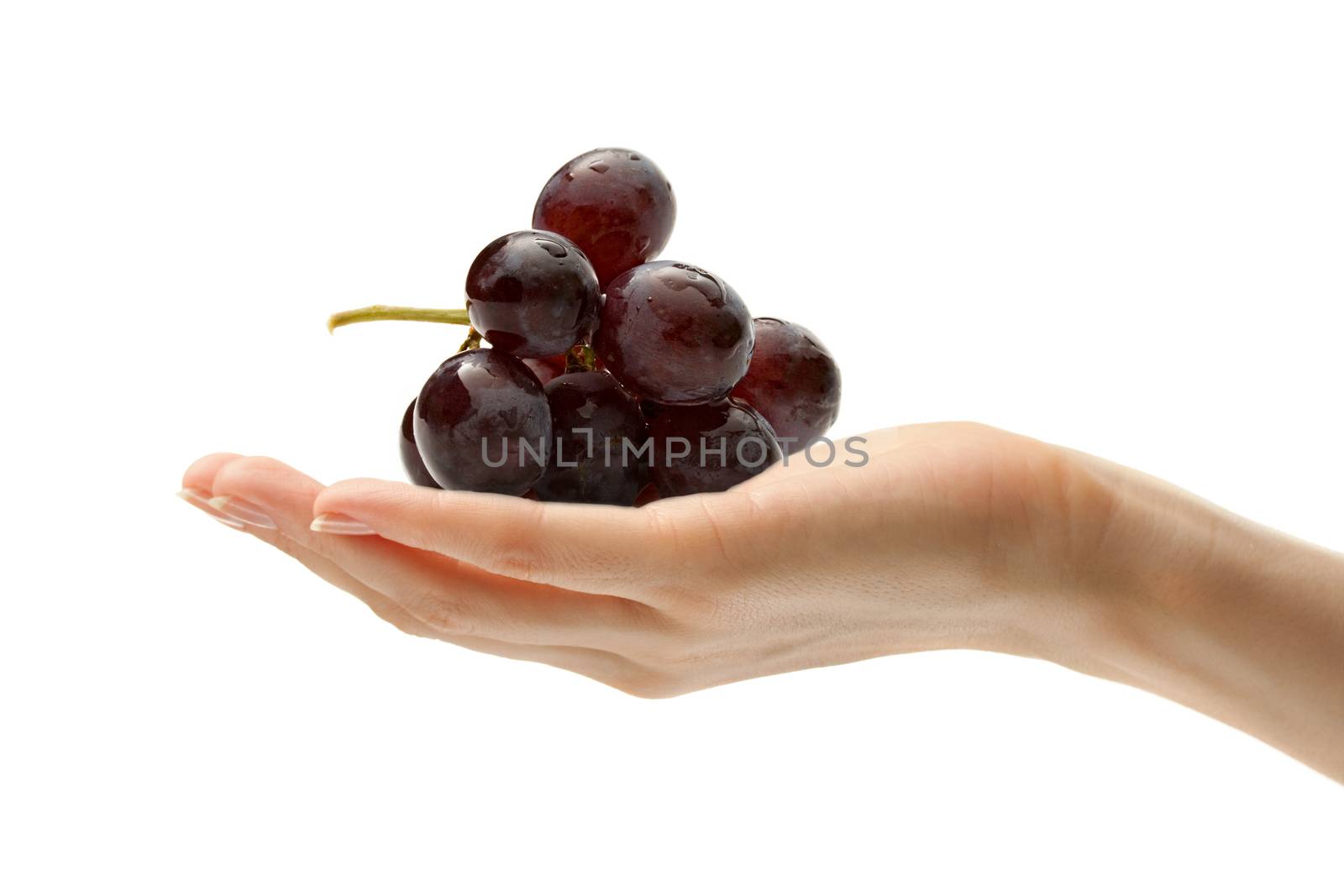 Female hand with some grapes