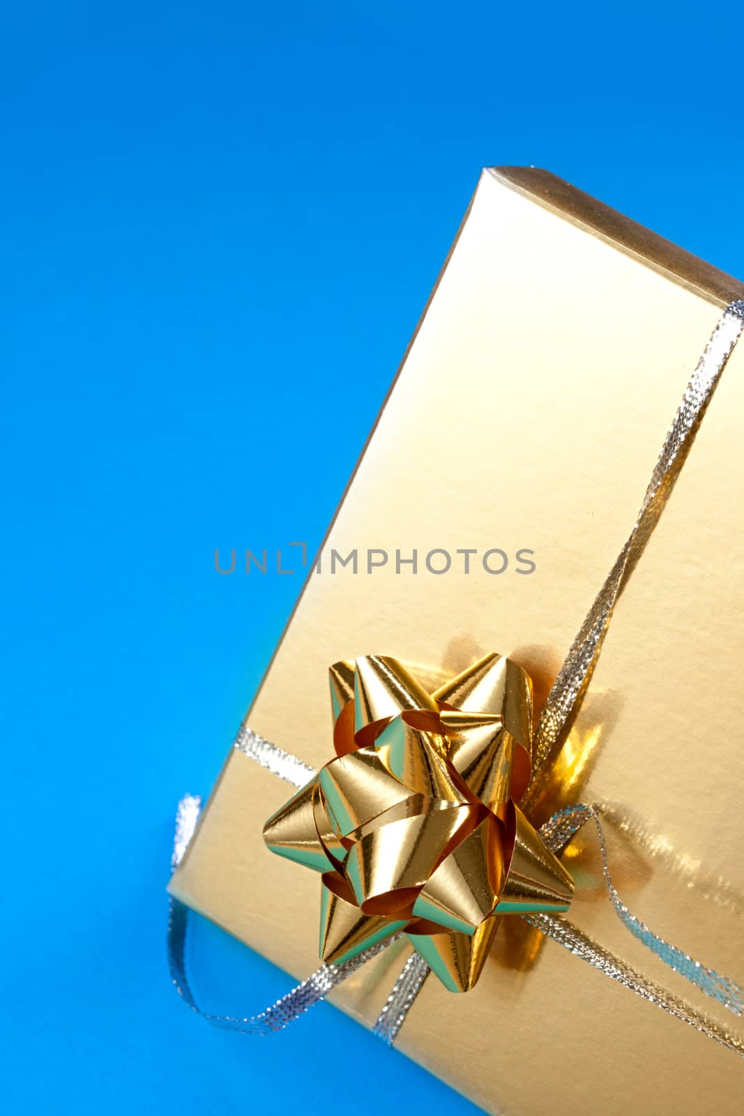 Decorated gift box on the blue background by Garsya