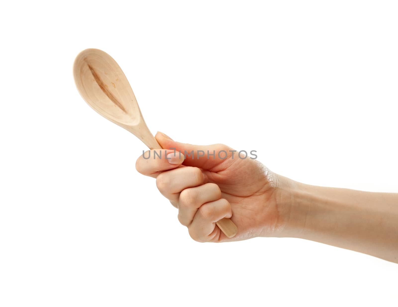 Wooden spoon in female hand by Garsya